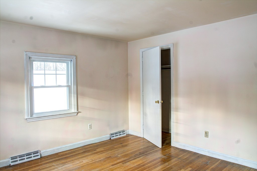 47 Amble Road Chelmsford, MA 01824 - Photo 24 of 30 an empty room with wooden floor and windows