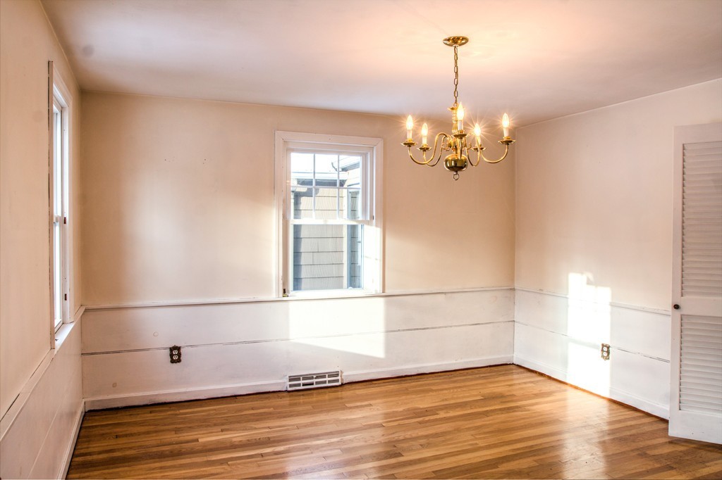 47 Amble Road Chelmsford, MA 01824 - Photo 8 of 30 a view of a chandelier fan and wooden floor