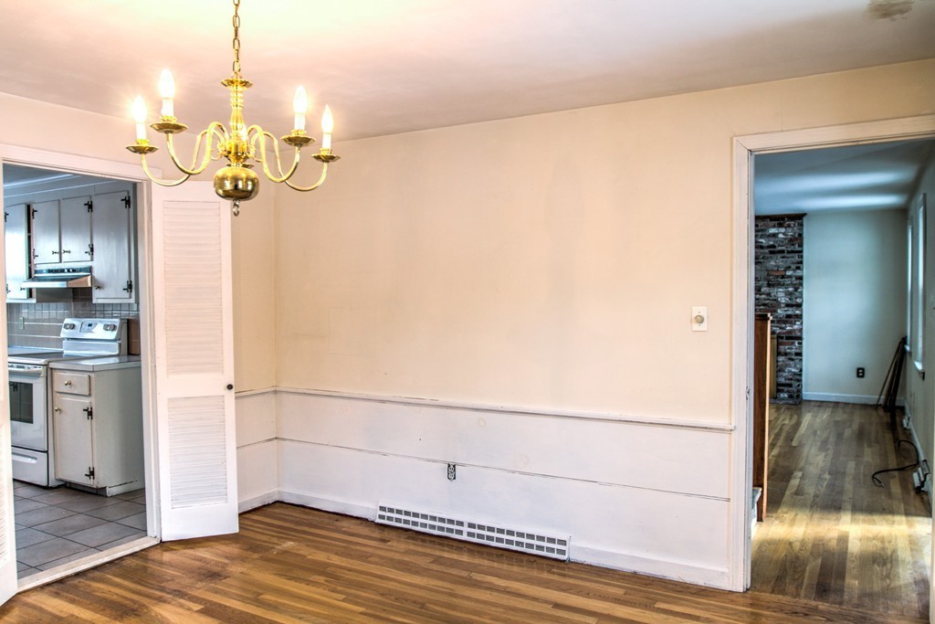 47 Amble Road Chelmsford, MA 01824 - Photo 9 of 30 a view of a chandelier fan and kitchen view