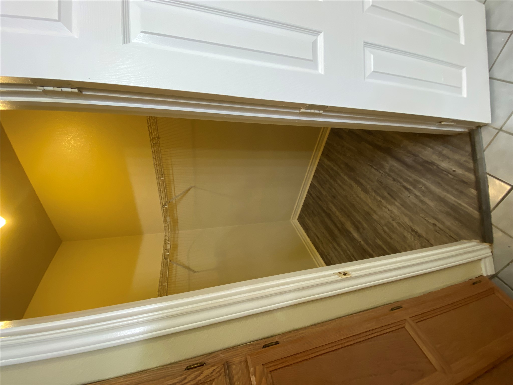 2605 Alcott Lane, Unit B Austin, TX 78748 - Photo 11 of 15 A well-organized closet offers practical storage solutions with durable flooring and ample shelving.