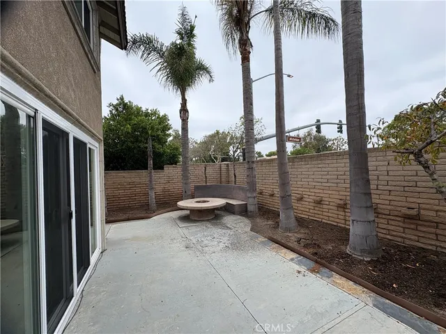 a view of a backyard with a patio