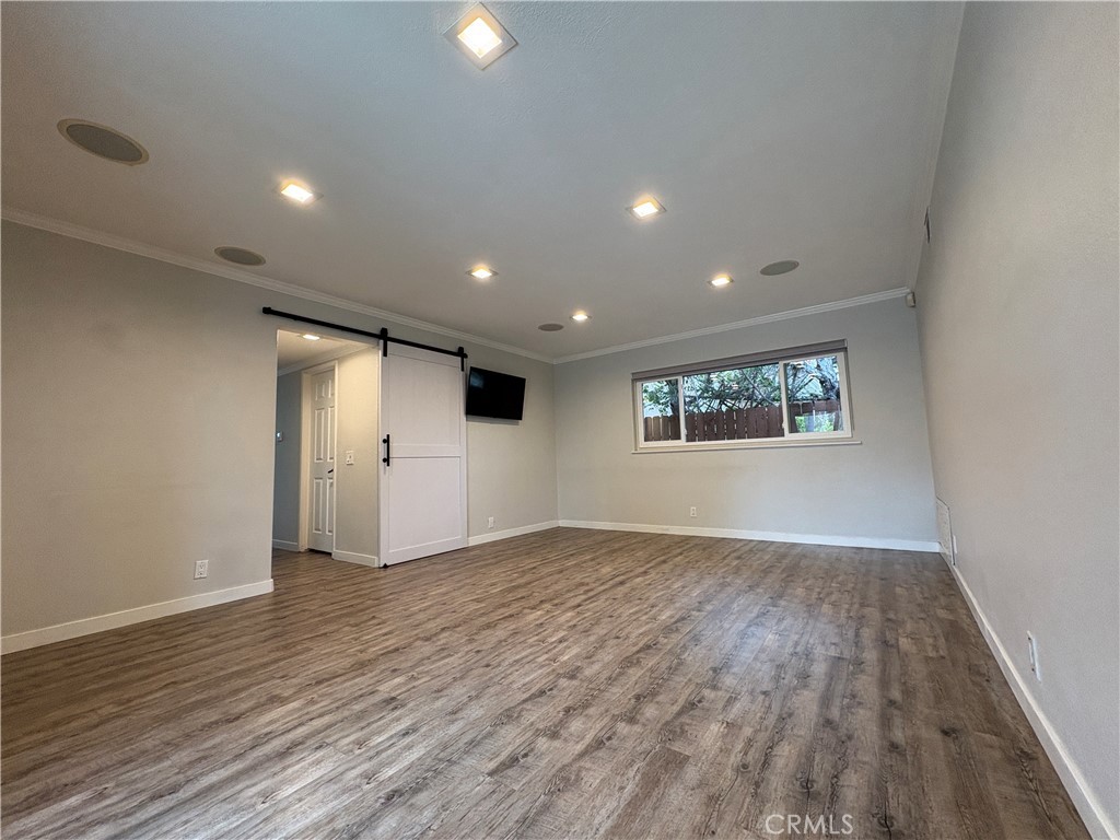1 Hopkins Street Irvine, CA 92612 - Photo 16 of 37 an empty room with wooden floor and windows