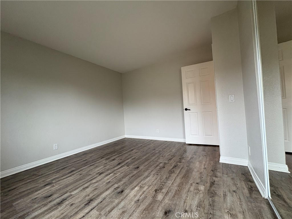 1 Hopkins Street Irvine, CA 92612 - Photo 20 of 37 a view of an empty room with wooden floor