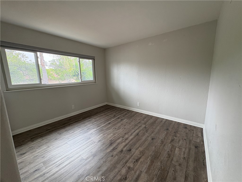 1 Hopkins Street Irvine, CA 92612 - Photo 21 of 37 an empty room with wooden floor and windows