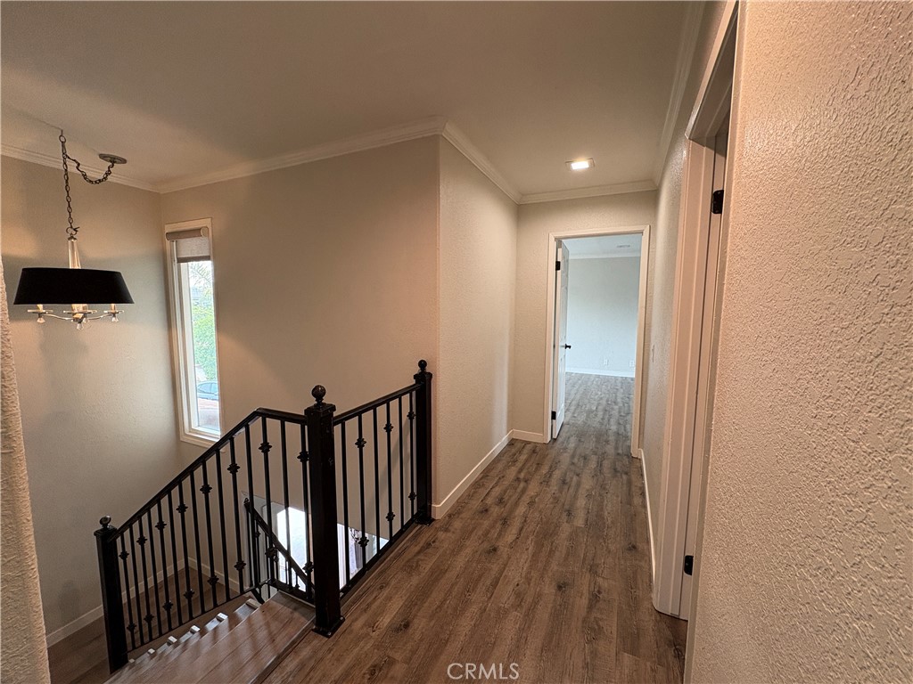 1 Hopkins Street Irvine, CA 92612 - Photo 22 of 37 a view of a hallway with wooden floor and staircase