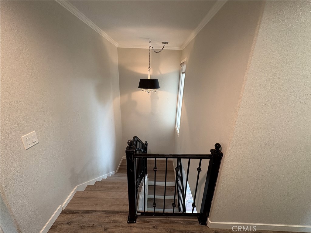 1 Hopkins Street Irvine, CA 92612 - Photo 23 of 37 a view of a hallway with wooden floor and staircase