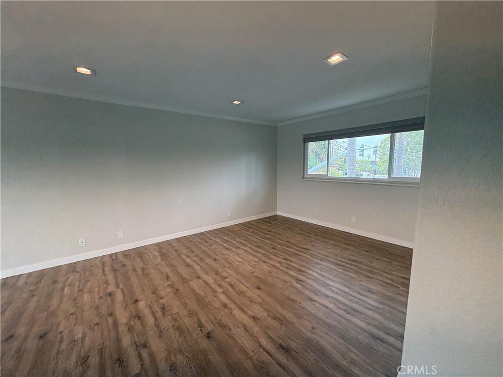 1 Hopkins Street Irvine, CA 92612 - Photo 25 of 37 an empty room with wooden floor and windows