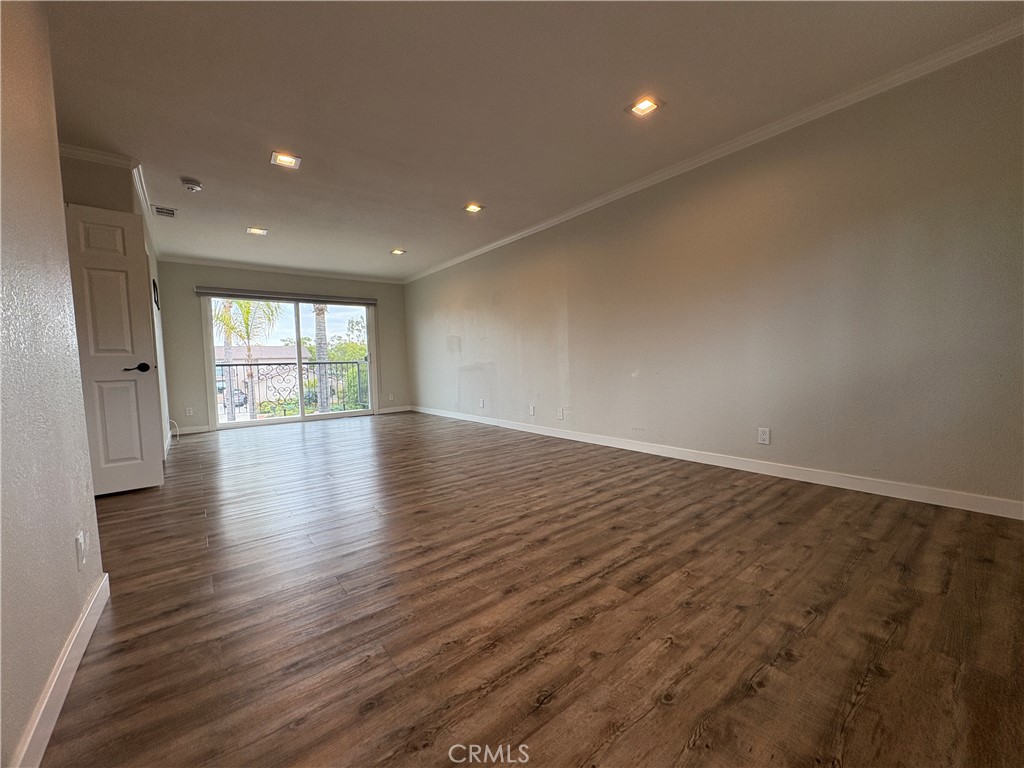 1 Hopkins Street Irvine, CA 92612 - Photo 26 of 37 an empty room with wooden floor and windows