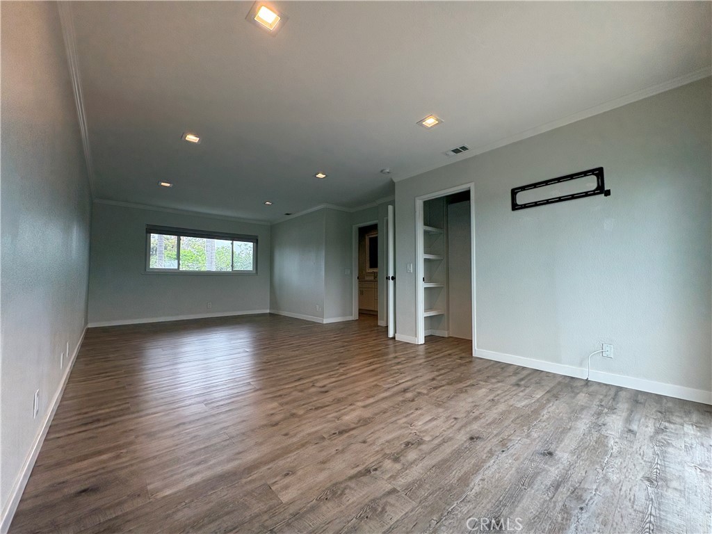 1 Hopkins Street Irvine, CA 92612 - Photo 27 of 37 an empty room with wooden floor and windows