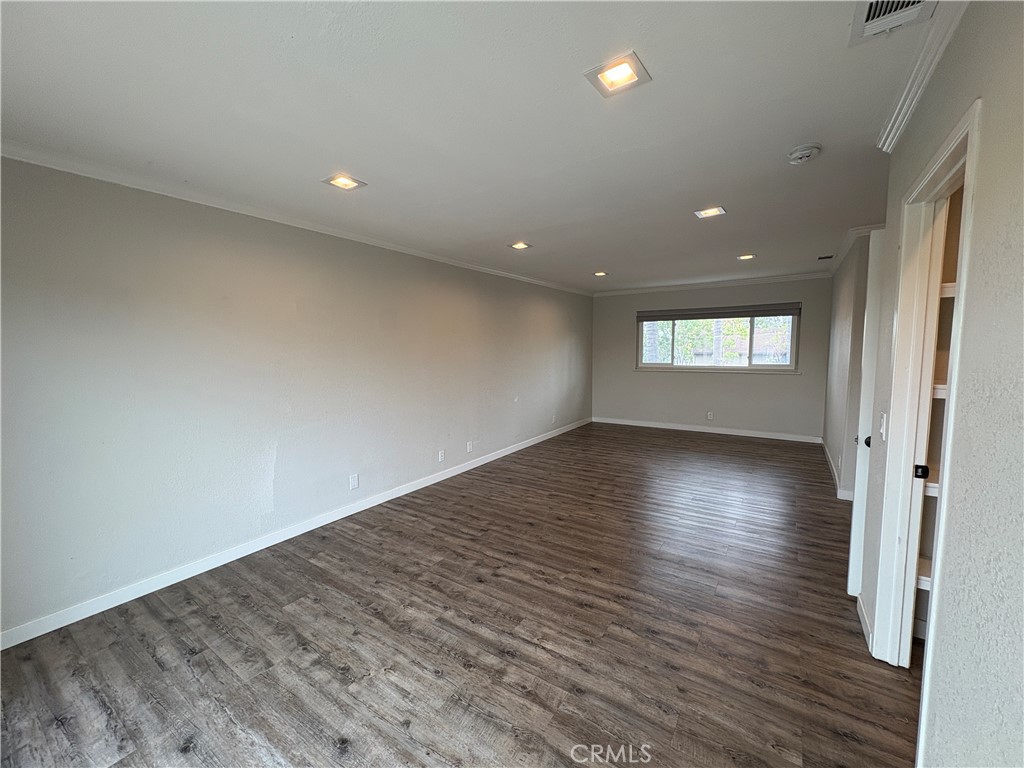 1 Hopkins Street Irvine, CA 92612 - Photo 28 of 37 an empty room with wooden floor and windows