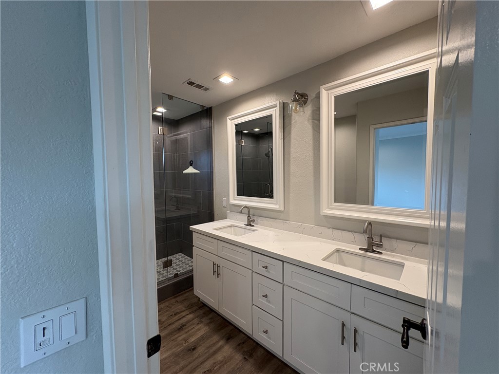 1 Hopkins Street Irvine, CA 92612 - Photo 30 of 37 a spacious bathroom with a double vanity sink mirror and toilet