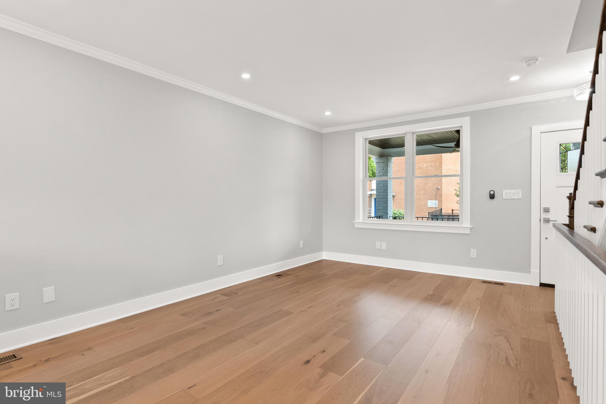 1841 E Street Northeast Washington, DC 20002 - Photo 11 of 50 wooden floor in an empty room with a window