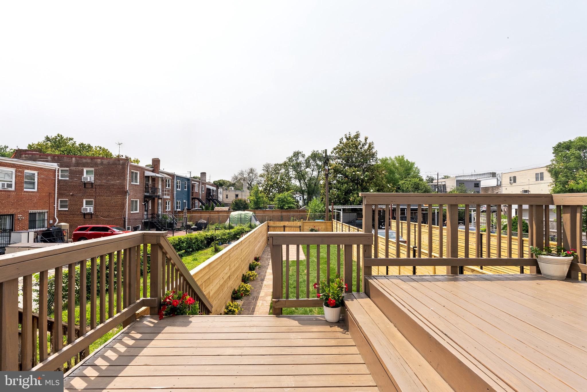 1841 E Street Northeast Washington, DC 20002 - Photo 19 of 50 a view of a balcony with wooden floor and fence