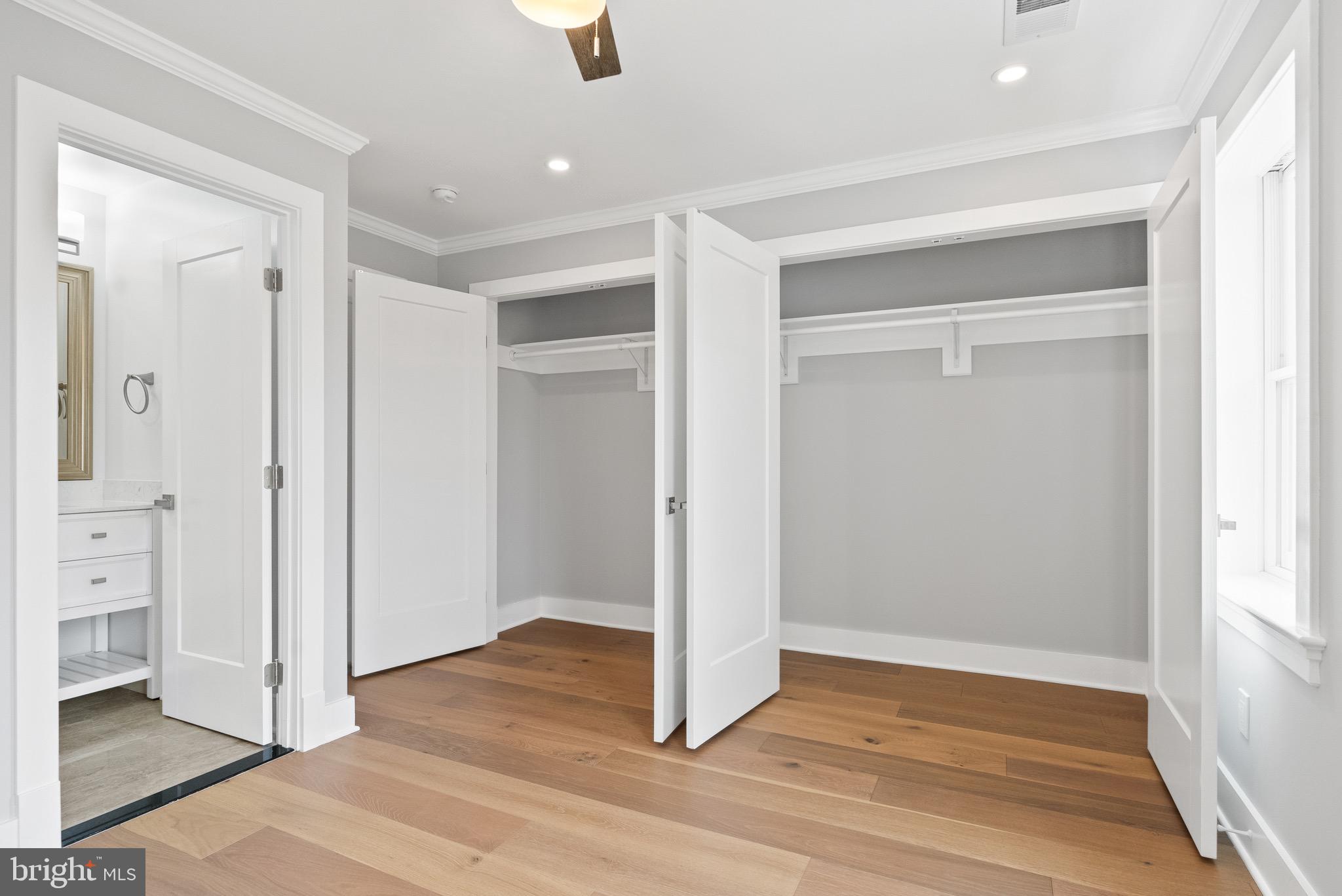 1841 E Street Northeast Washington, DC 20002 - Photo 27 of 50 an empty room with wooden floor and windows