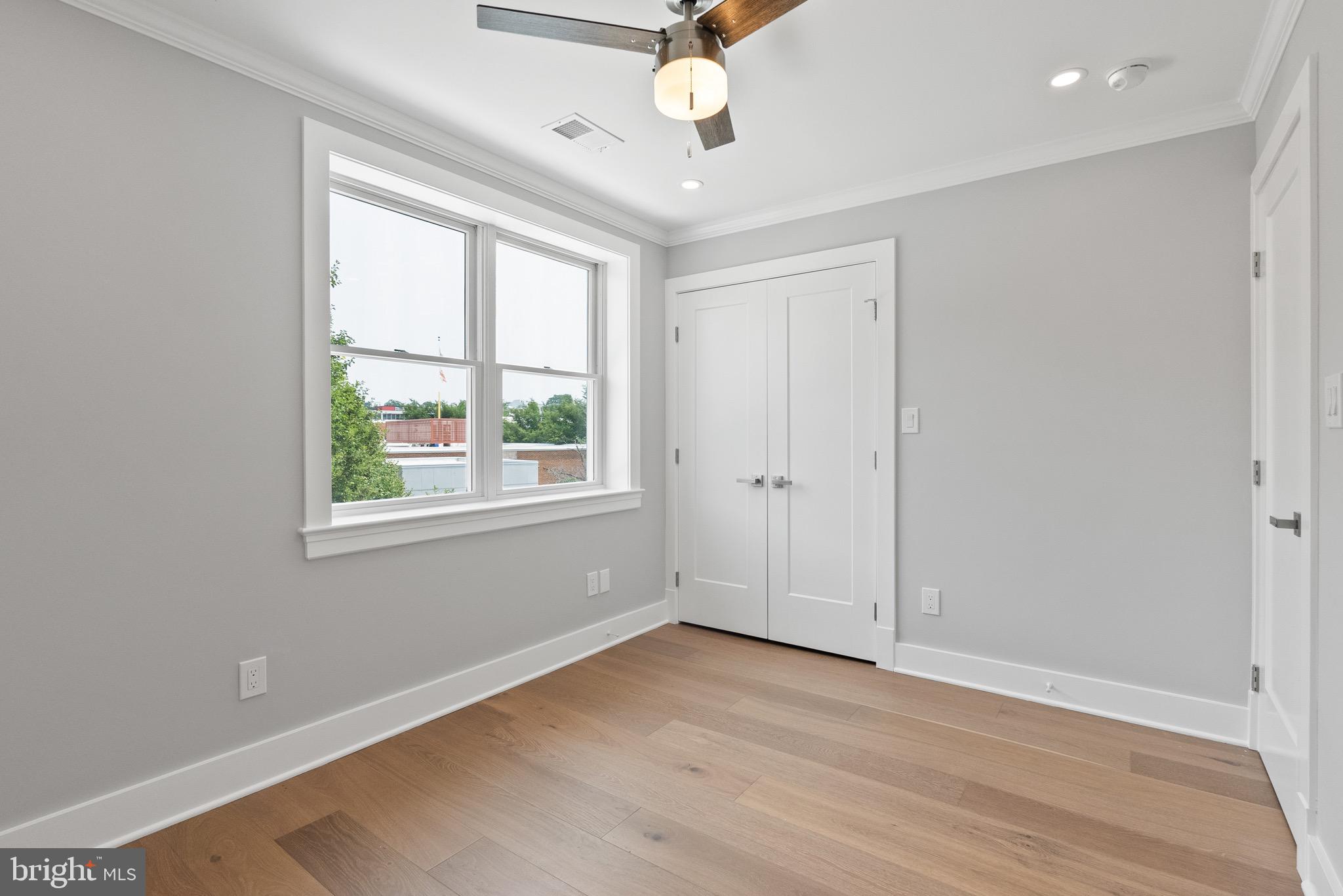 1841 E Street Northeast Washington, DC 20002 - Photo 33 of 50 wooden floor in an empty room with a window