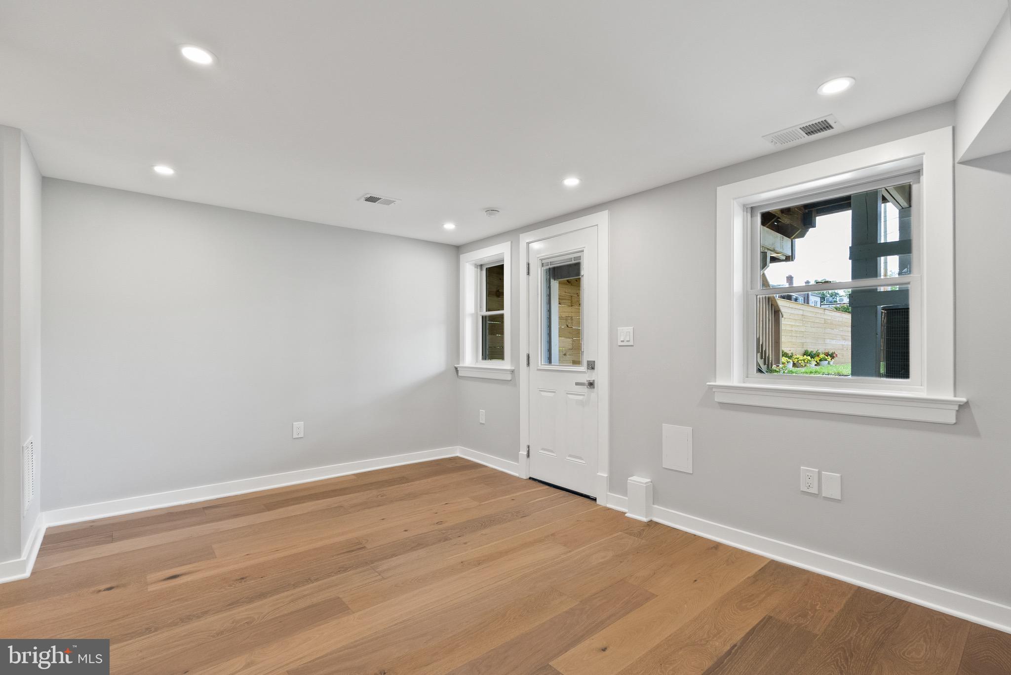 1841 E Street Northeast Washington, DC 20002 - Photo 39 of 50 a view of empty room with window and wooden floor
