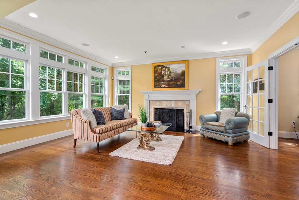 42 Victoria Road Sudbury, MA 01776 - Photo 13 of 42 a living room with furniture and a fireplace