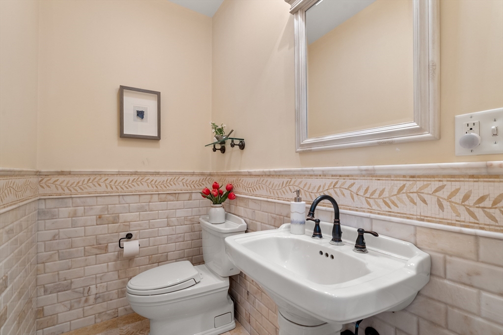 42 Victoria Road Sudbury, MA 01776 - Photo 16 of 42 a bathroom with a sink mirror and toilet
