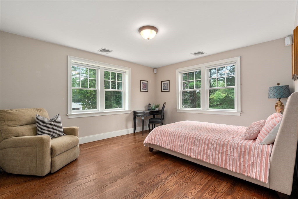 42 Victoria Road Sudbury, MA 01776 - Photo 23 of 42 a bedroom with a bed and a couch with window