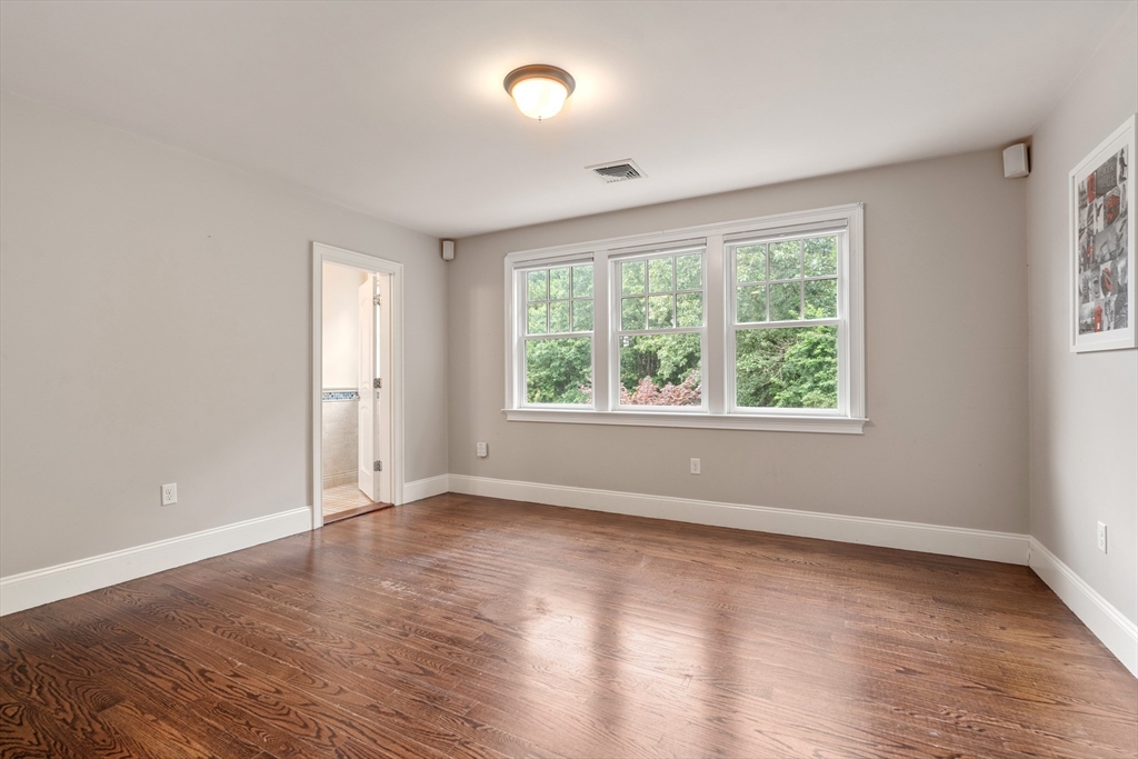 42 Victoria Road Sudbury, MA 01776 - Photo 25 of 42 an empty room with wooden floor and windows