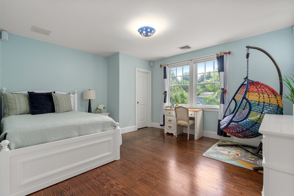 42 Victoria Road Sudbury, MA 01776 - Photo 26 of 42 a bedroom with a bed and wooden floor