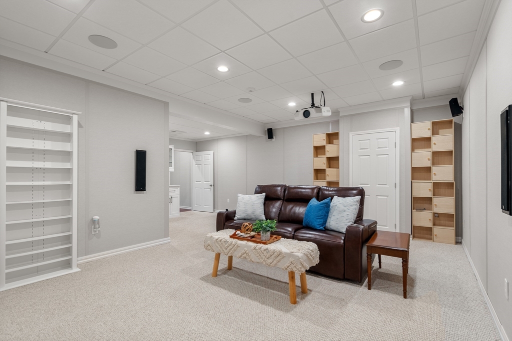 42 Victoria Road Sudbury, MA 01776 - Photo 29 of 42 a living room with furniture and a ceiling fan