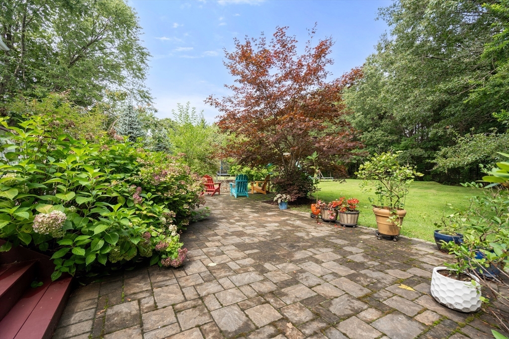42 Victoria Road Sudbury, MA 01776 - Photo 34 of 42 a view of a garden with an outdoor seating