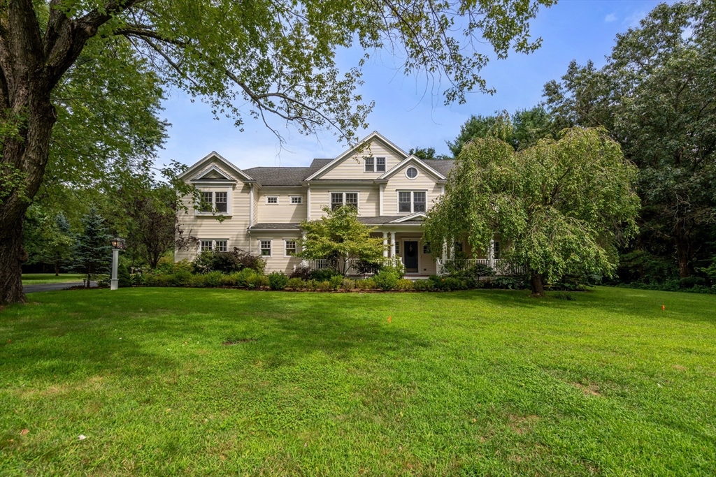 42 Victoria Road Sudbury, MA 01776 - Photo 4 of 42 a front view of a house with a garden