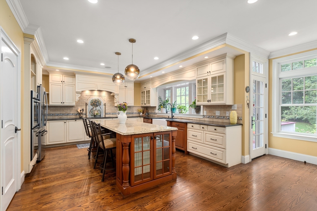 42 Victoria Road Sudbury, MA 01776 - Photo 9 of 42 a kitchen with counter top space a sink appliances and cabinets