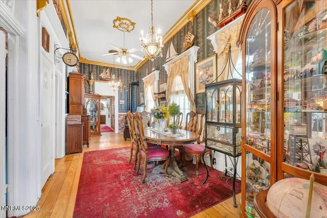 a living room with furniture a rug and a painting on the wall