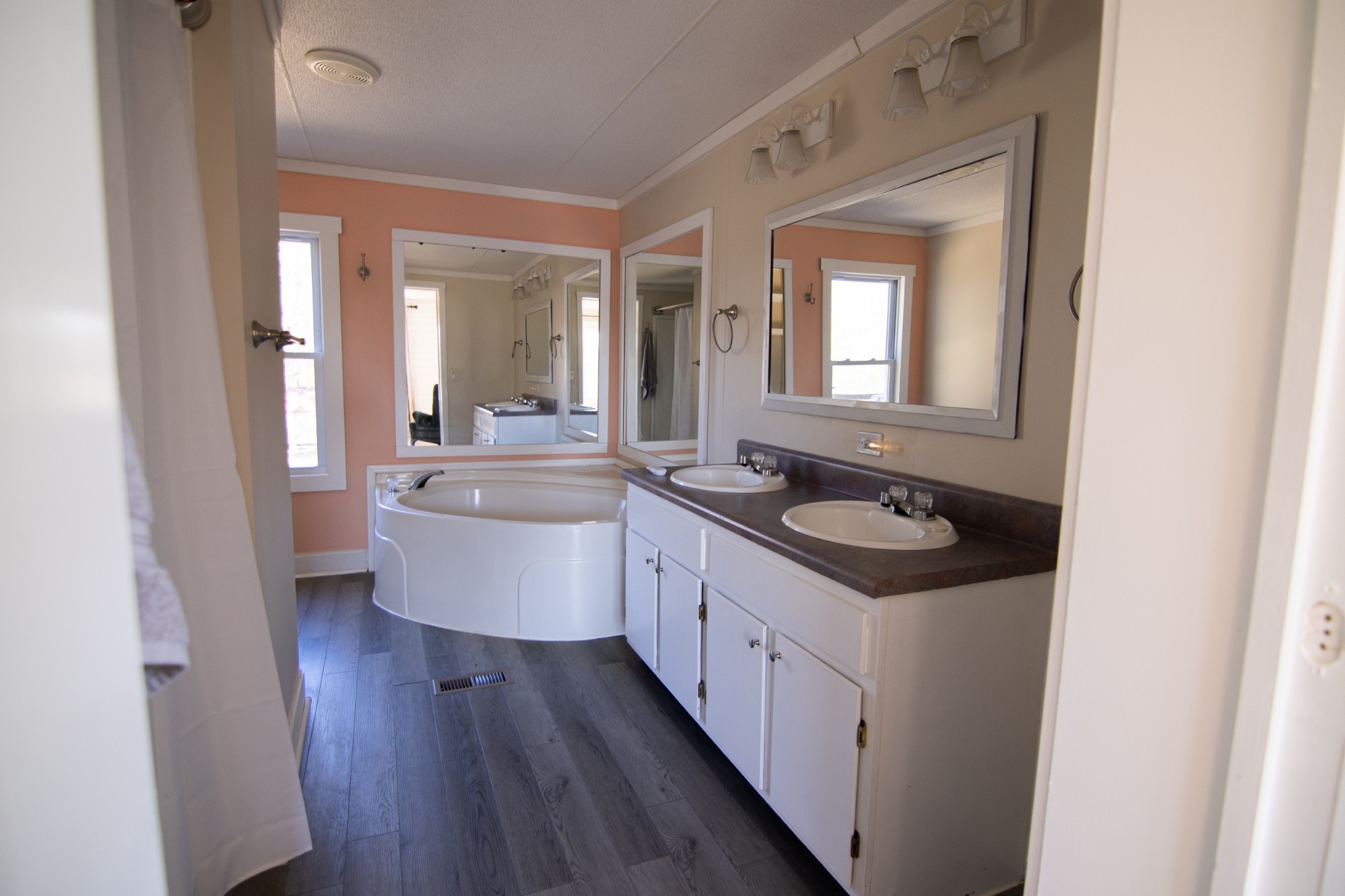 1712 John Sharp Road Spring Hill, TN 37174 - Photo 7 of 22 a bathroom with a double vanity sink a mirror and a shower