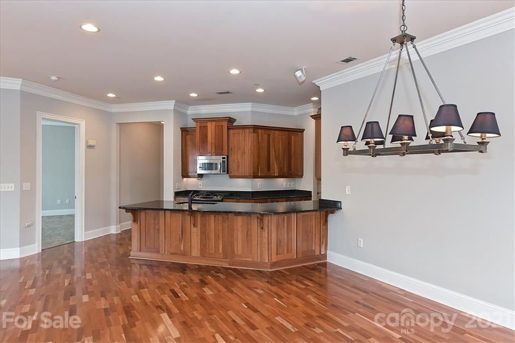 626 Queens Road, Unit 203 Charlotte, NC 28207 - Photo 17 of 48 a view of a kitchen with a sink and a window