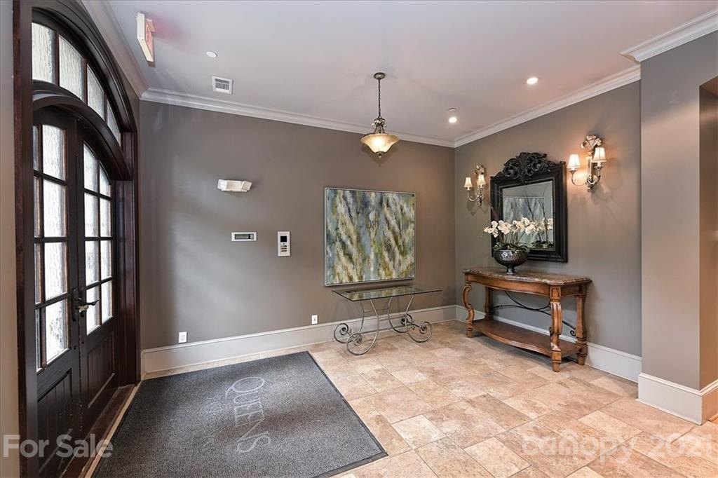 626 Queens Road, Unit 203 Charlotte, NC 28207 - Photo 3 of 48 a view of a livingroom with furniture and windows