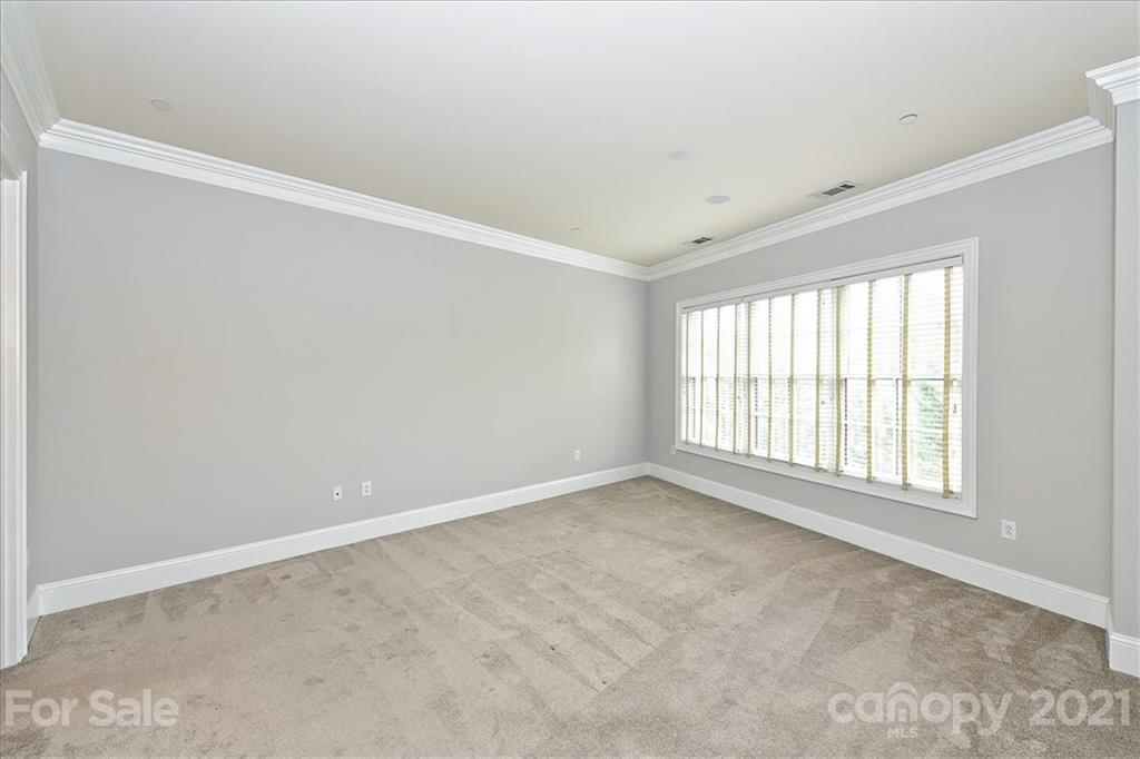 626 Queens Road, Unit 203 Charlotte, NC 28207 - Photo 33 of 48 a view of an empty room with a window