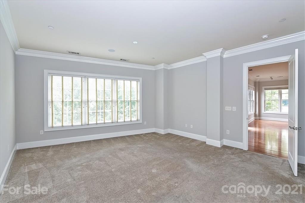626 Queens Road, Unit 203 Charlotte, NC 28207 - Photo 34 of 48 a view of an empty room with a window