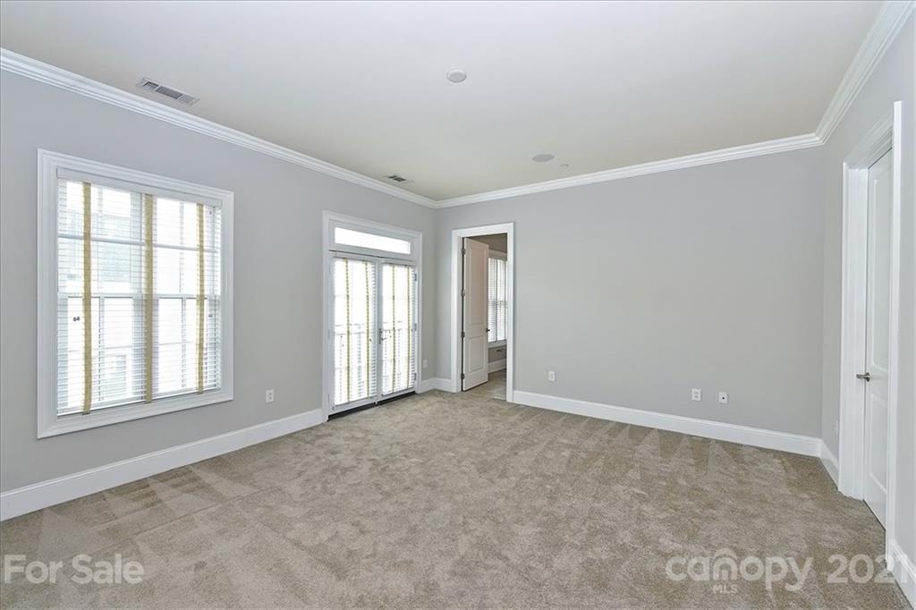 626 Queens Road, Unit 203 Charlotte, NC 28207 - Photo 39 of 48 a view of an empty room with a window