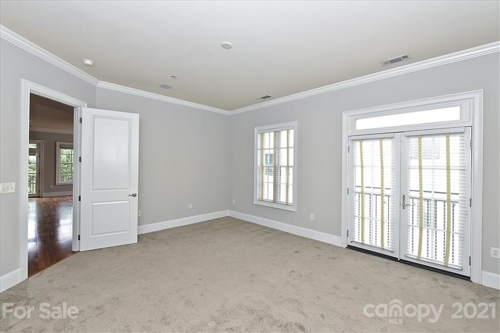 626 Queens Road, Unit 203 Charlotte, NC 28207 - Photo 40 of 48 a view of an empty room with a window