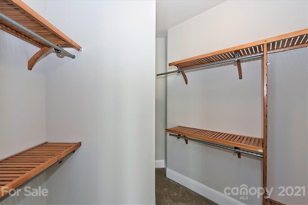 626 Queens Road, Unit 203 Charlotte, NC 28207 - Photo 41 of 48 a view of a hallway with stairs