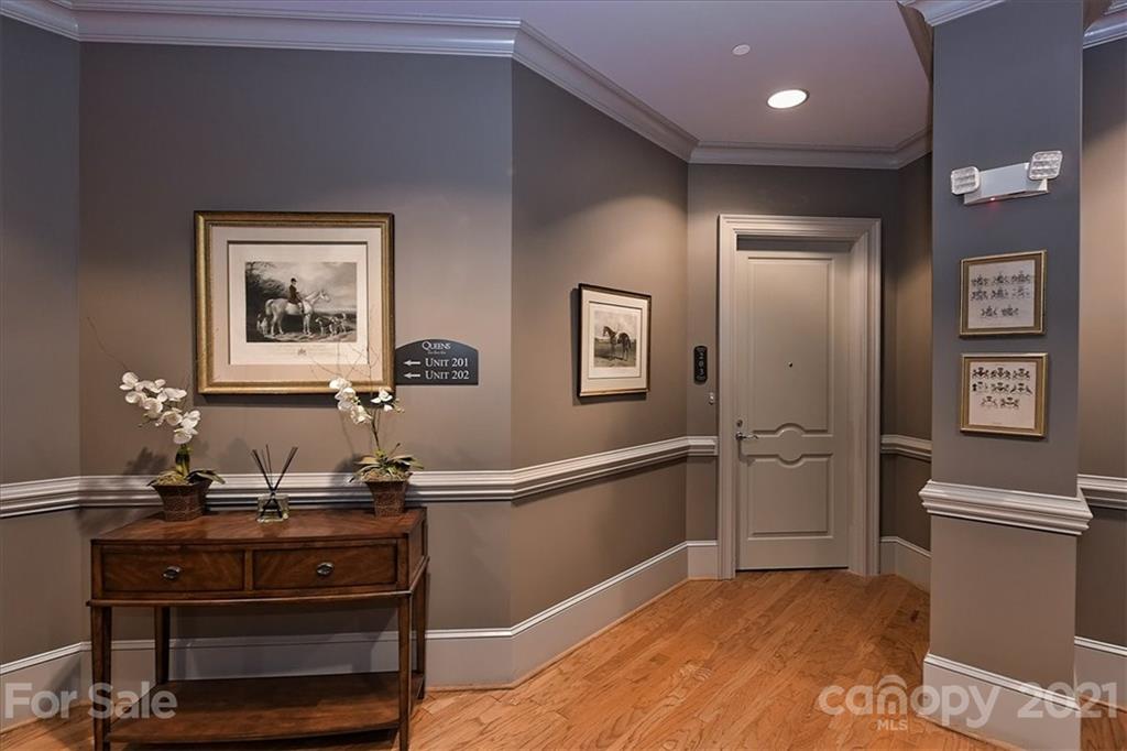626 Queens Road, Unit 203 Charlotte, NC 28207 - Photo 6 of 48 a view of a hallway with workspace