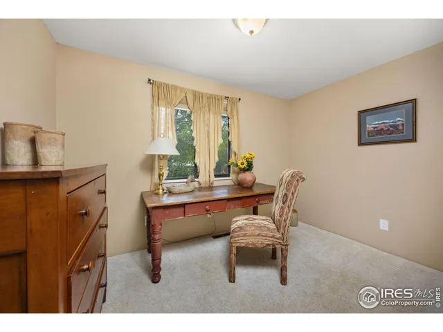 a workspace with furniture and window