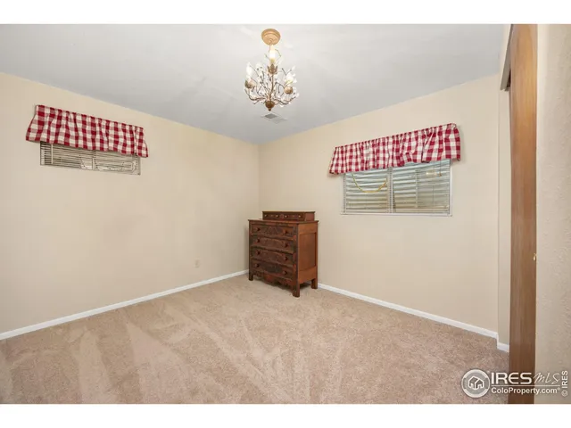 a bathroom with a granite countertop sink toilet a mirror a vanity and shower