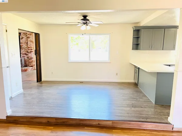 a view of room with window and hardwood floor