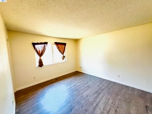 a view of a small space with wooden floor