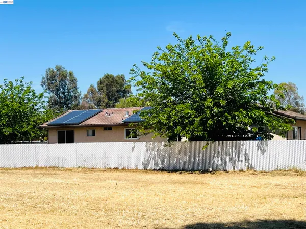 a view of a swimming pool with a yard