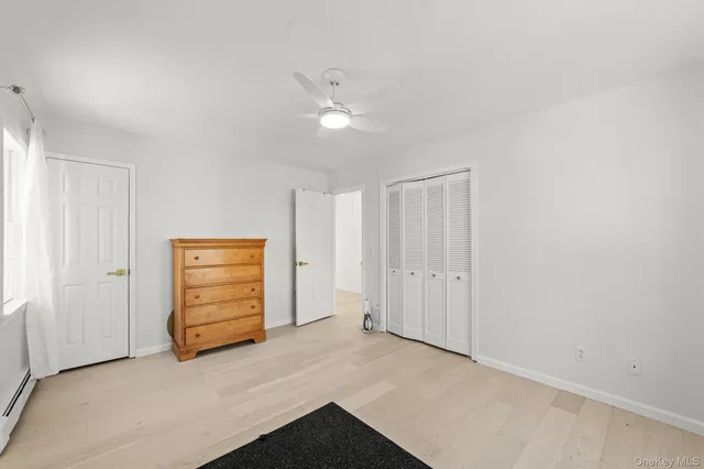 an empty room with closet and cabinet