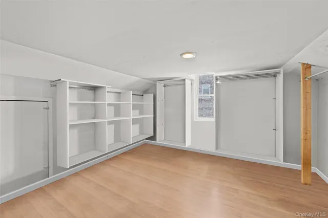 a view of an empty room with a closet