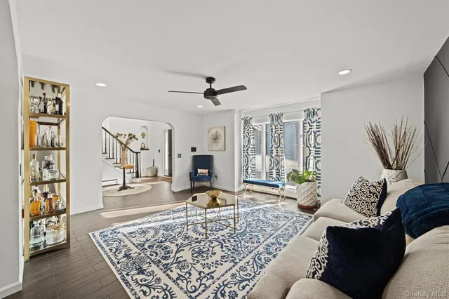 a living room with furniture and a rug