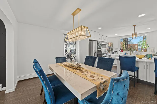 a kitchen with a table and chairs in it