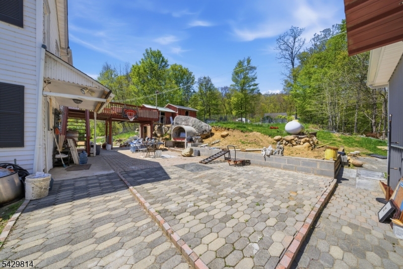 251 Russia Road Oak Ridge, NJ 07438 - Photo 28 of 34 a view of a backyard with sitting area