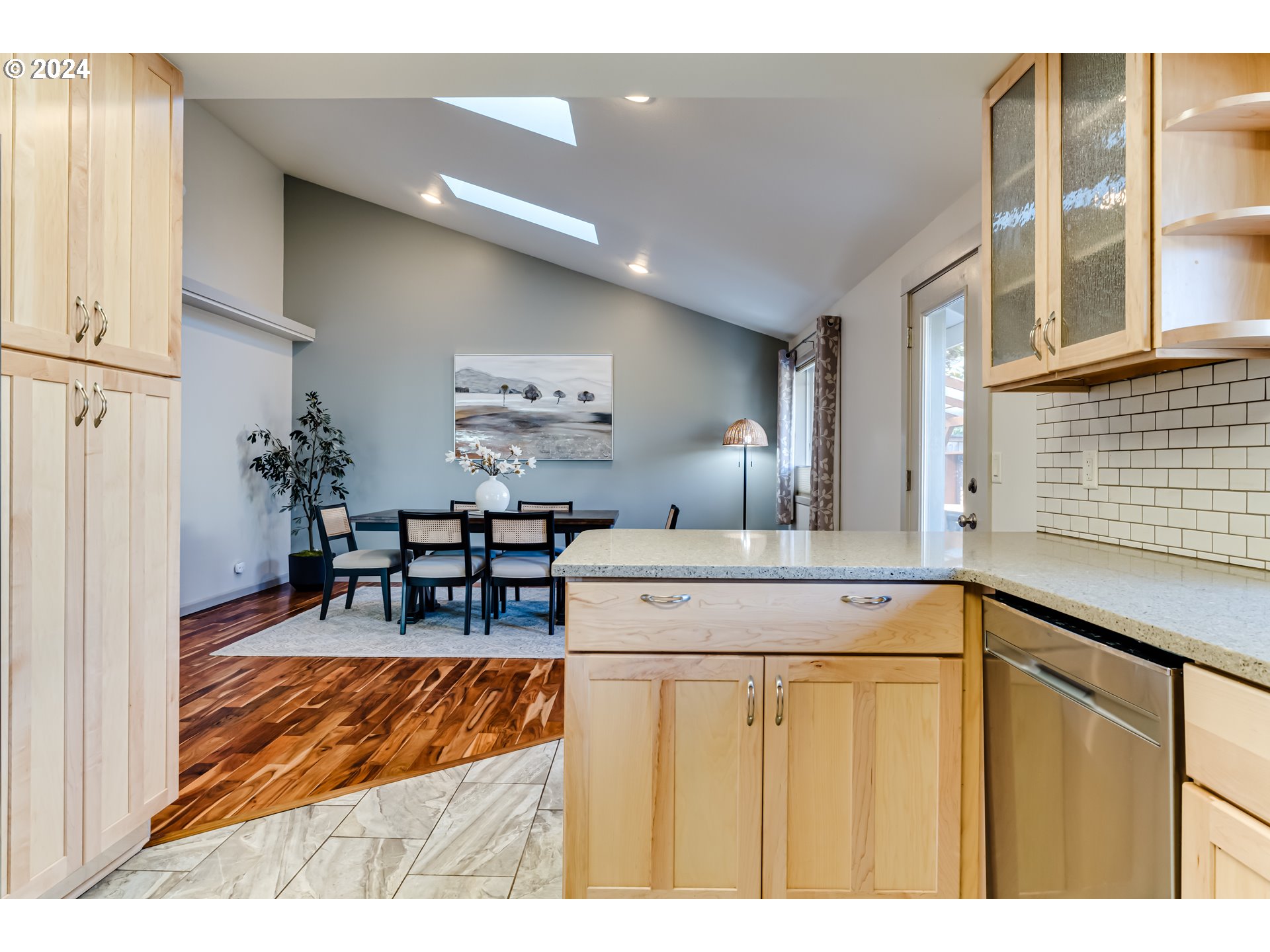 686 South 69th Place Springfield, OR 97478 - Photo 11 of 38 a view of dining room with kitchen island granite countertop furniture and a dining table